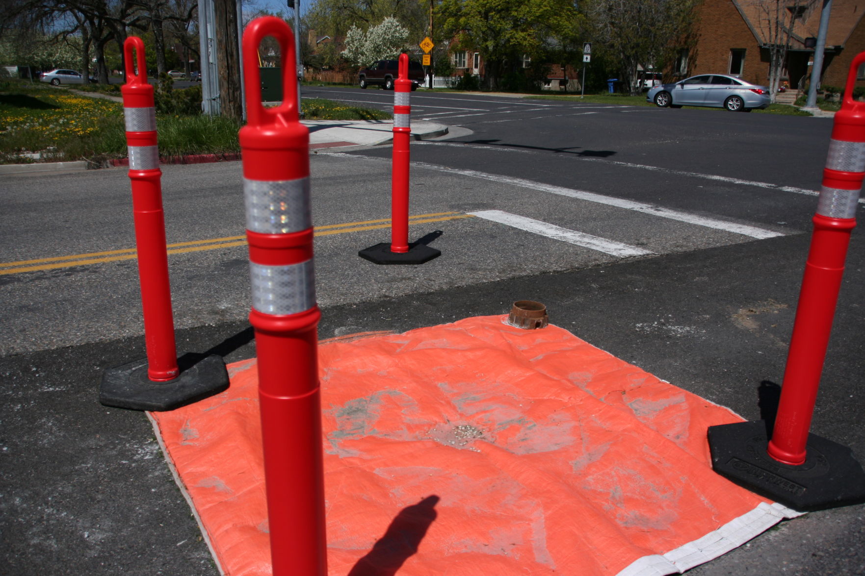 What's up with that? Some manholes raised to road level every year